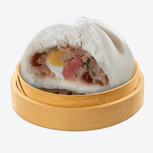 A wooden bowl containing Bola-bola Siopao Supreme