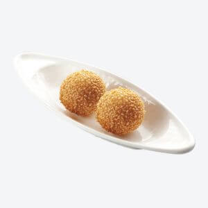 2 pieces of buchi served on a curved shaped dish