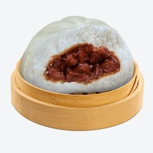 A wooden bowl serving Chunky Asado Siopao