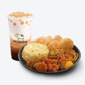 Mlikshake and a blacke plate serves sweet & sour pork lauriat